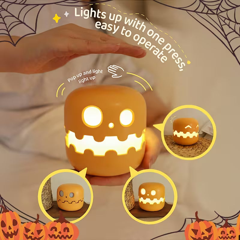 Halloween-themed night light with pumpkins and spider webs, featuring text on operation.