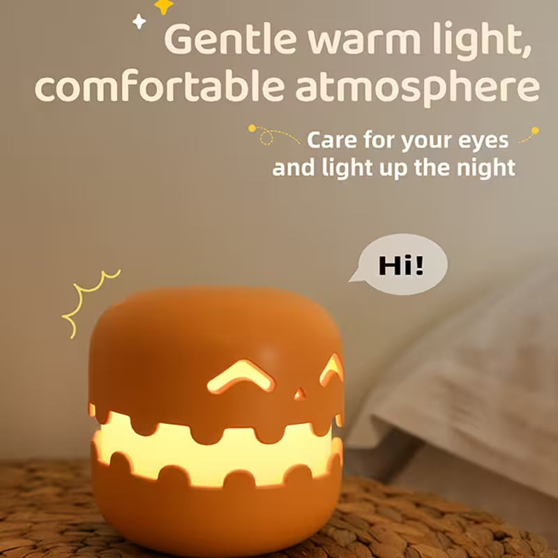 Cute pumpkin-shaped night light with a warm glow on a woven surface, featuring text about its benefits.
