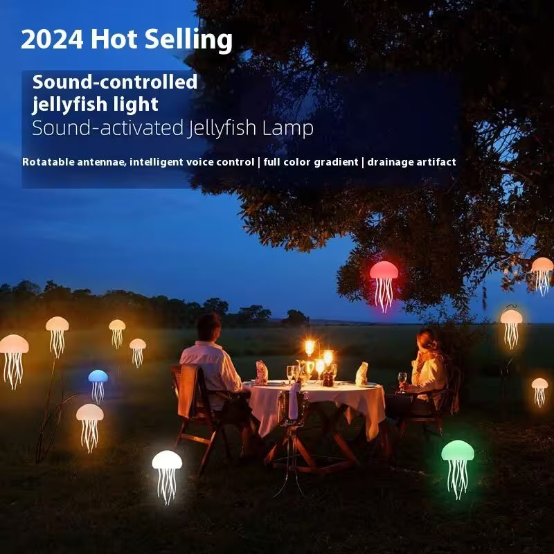 People sitting at a dinner table with sound-controlled jellyfish lights in a natural setting.