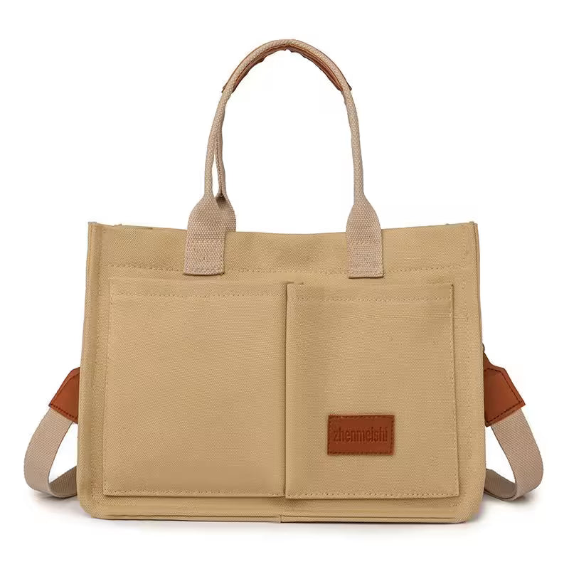 Beige tote bag with brown accents on a white background