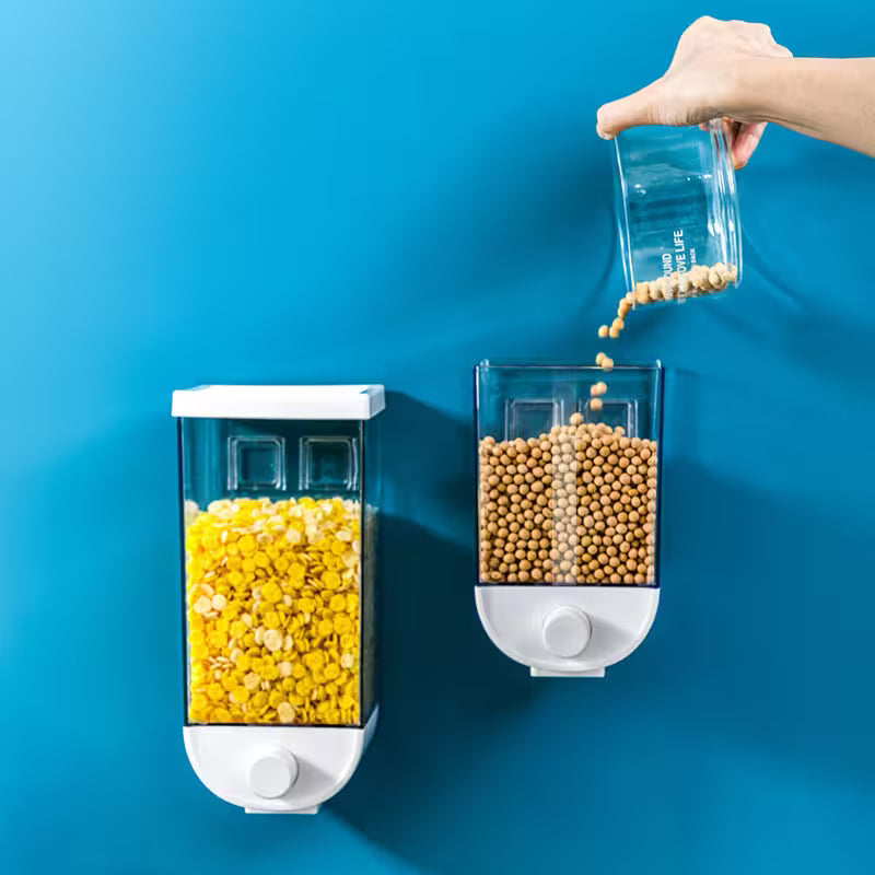 Two wall-mounted containers with yellow and brown pellets on a blue background