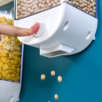 Person pressing a button on a snack dispenser with snacks spilling out.
