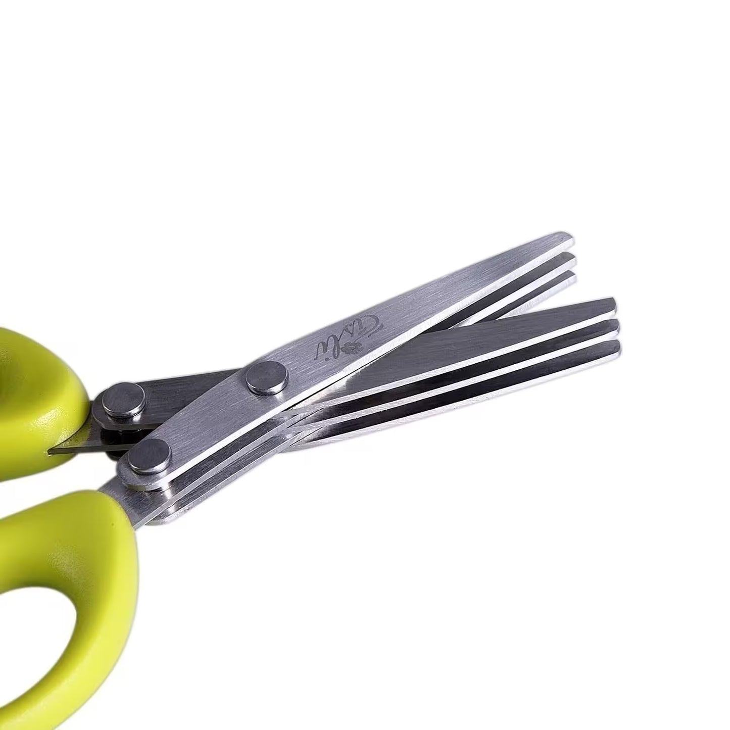 Scissors with green handles on a white background