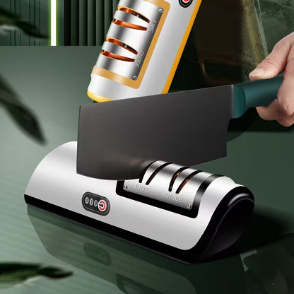 Knife sharpener with a knife being sharpened on a reflective surface