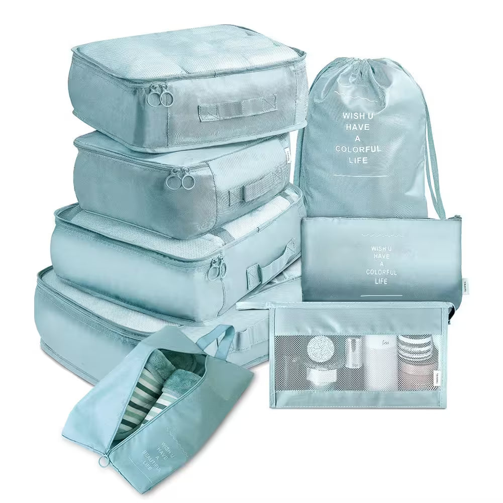 Set of light blue packing cubes and bags with text on a white background