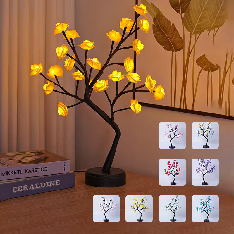 Decorative LED tree lamp on a wooden surface with color-changing options displayed.