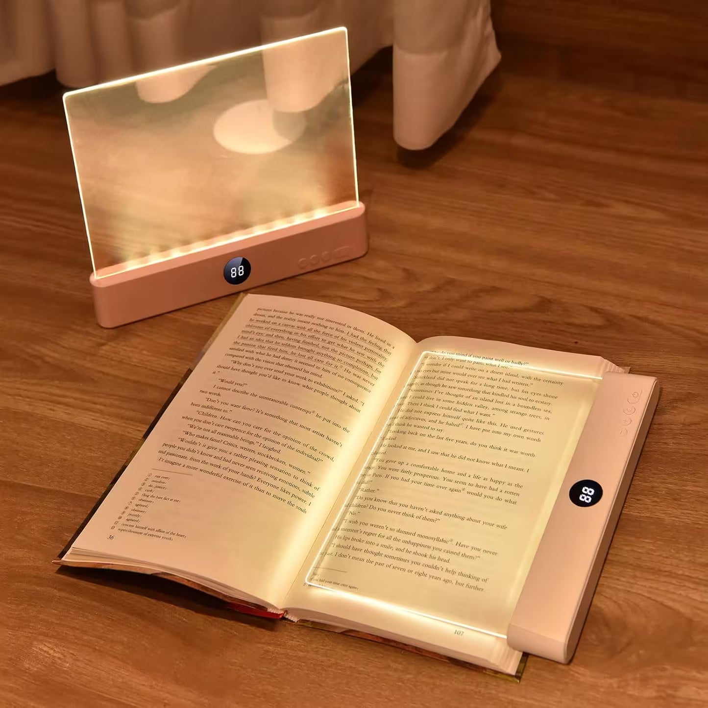 Lighted reading devices on a wooden surface