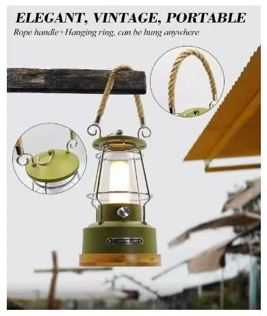 Green lantern with rope handle and hanging ring, shown outdoors.