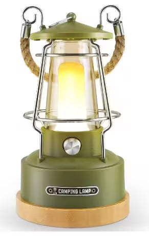 Green camping lantern with a warm glow on a white background