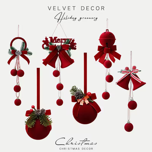 Collection of red Christmas decorations with bows and greenery on a white background.
