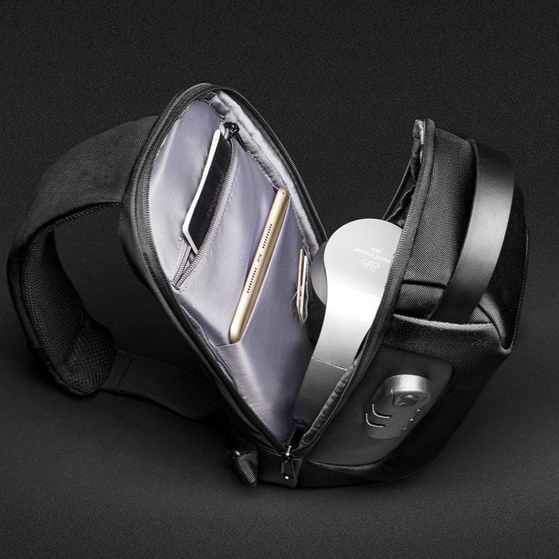 Black waist bag with a clear compartment on a dark background