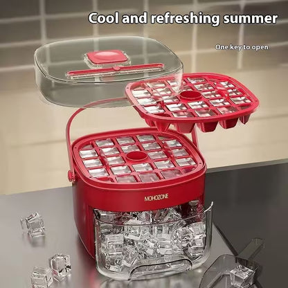 Red ice cube tray with clear plastic components on a reflective surface.