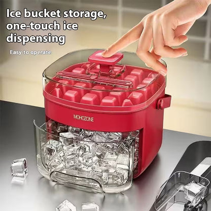 Red ice maker with clear container on a countertop, showing ice cubes and a hand pressing a button.