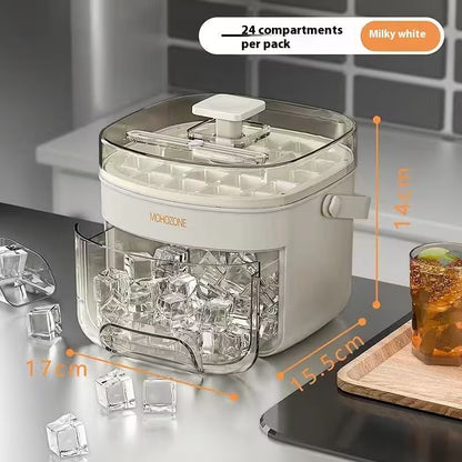 Ice cube maker with clear cubes and dimensions on a kitchen counter.