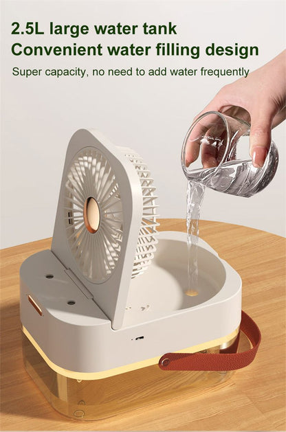 Hand filling a 2.5L water tank into a portable fan on a wooden surface.