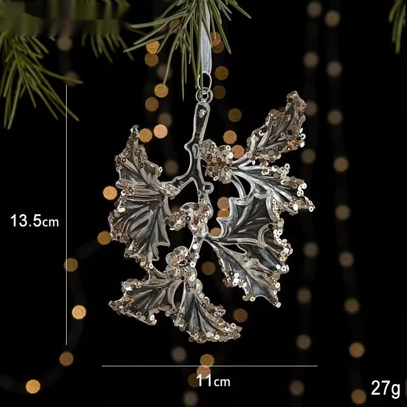 Decorative silver leaf ornament with measurements on a dark background