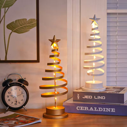 Two spiral LED lamps on a table with a clock and books in the background.