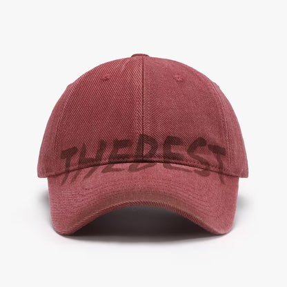 Red cap with 'THE BEST' text on a white background