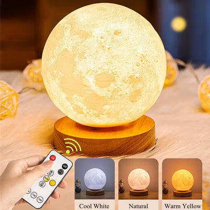Moon lamp with remote control on a wooden base, surrounded by similar lamps.