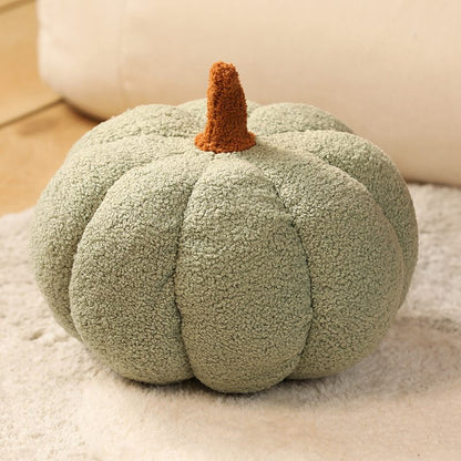 Green textured pumpkin-shaped pillow on a neutral background