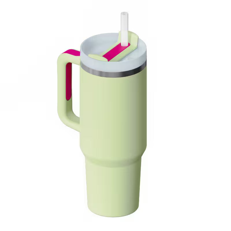 Light green tumbler with a pink handle and straw on a white background