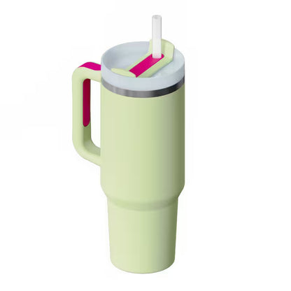 Light green tumbler with a pink handle and straw on a white background