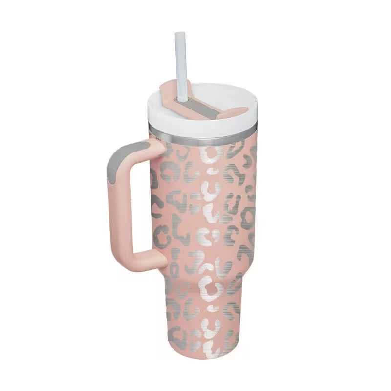 Pink tumbler with leopard print pattern on a white background