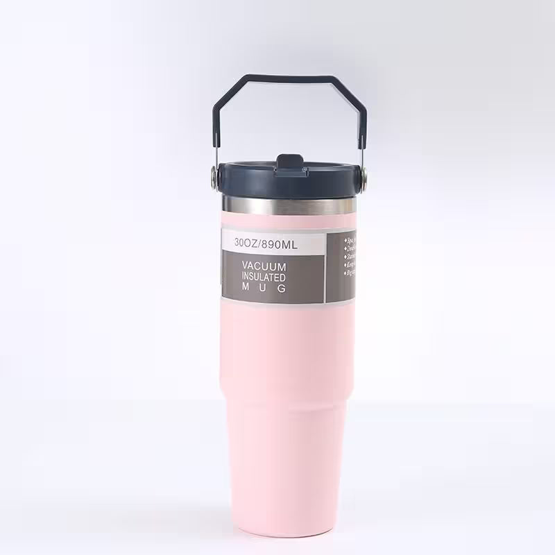 Pink vacuum insulated mug with black lid on a white background