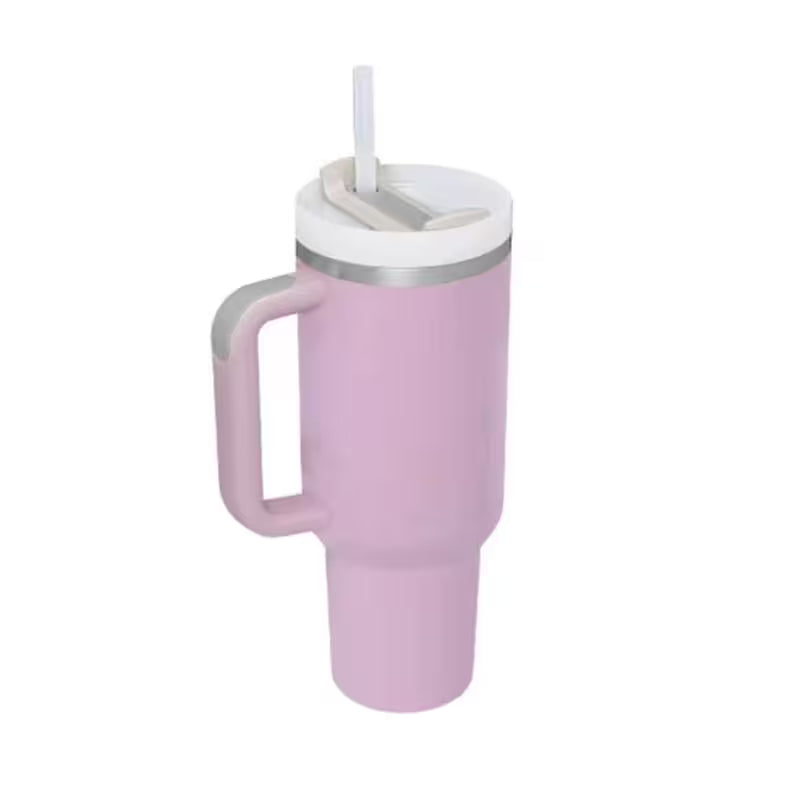 Pink tumbler with a handle and straw lid on a white background
