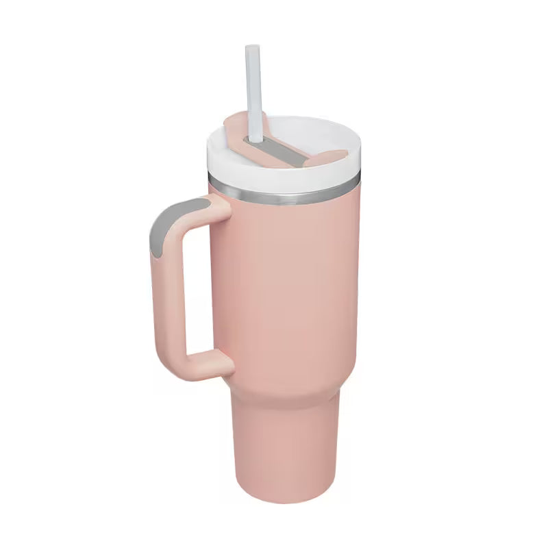 Pink travel mug with a handle and straw lid on a white background