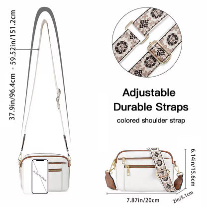 White handbag with adjustable floral strap and measurements on a white background