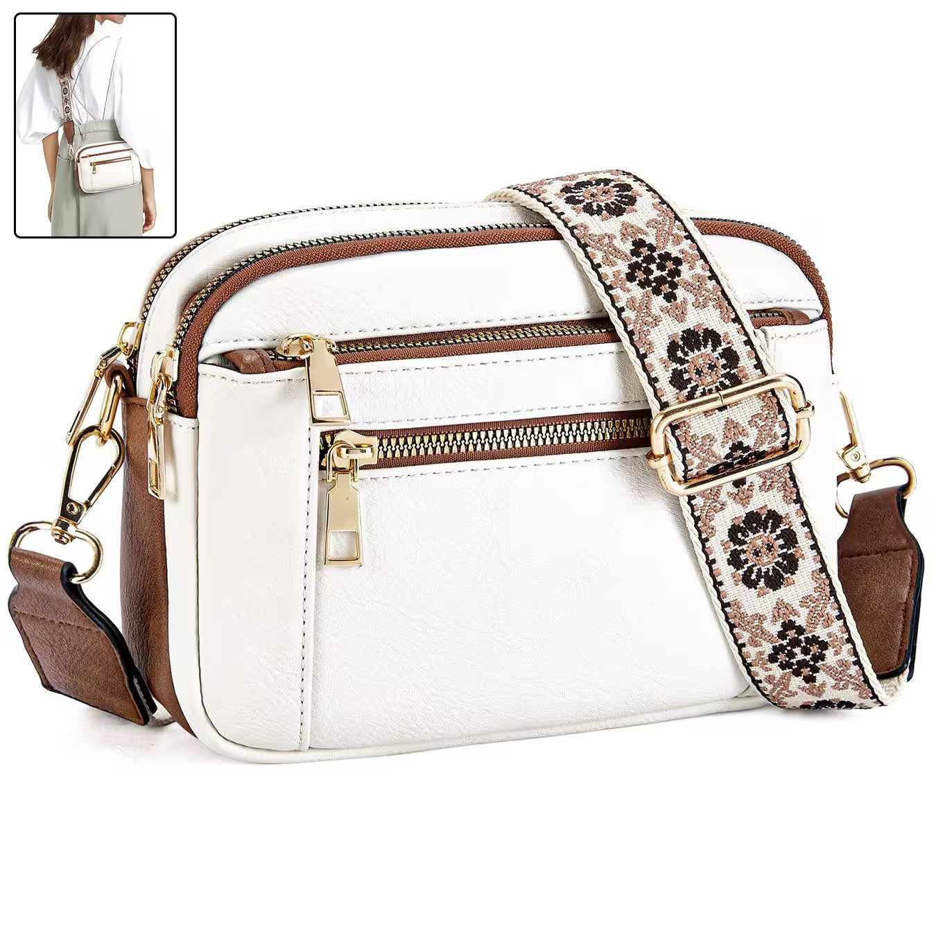 White handbag with floral strap and gold zippers on a white background
