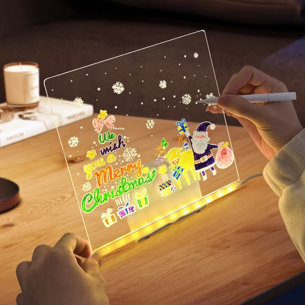 Person drawing on a transparent board with Christmas-themed graphics and text.