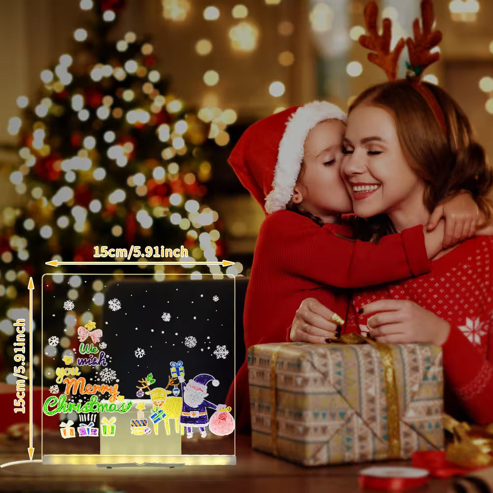 Woman and child in festive attire with a Christmas-themed light-up sign and tree in the background.