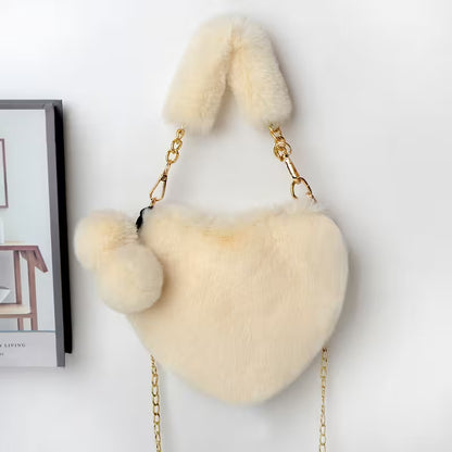 Heart-shaped fur bag with bunny ears on a white background
