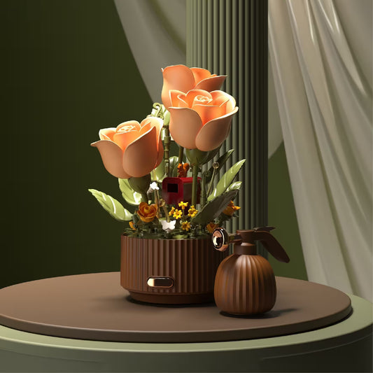 Decorative flower arrangement with a small house and pumpkins on a round surface.