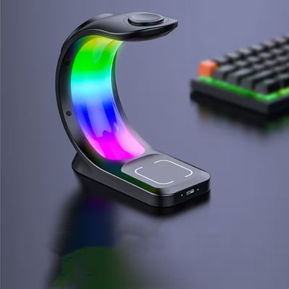 Colorful LED lamp with wireless charging pad on a dark surface