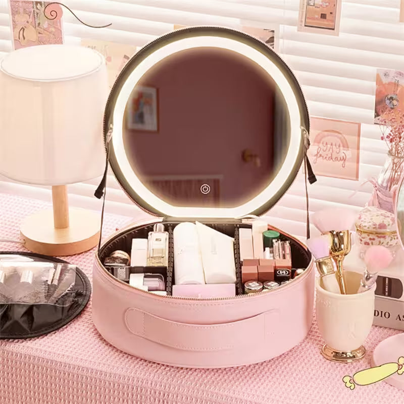 Pink makeup case with a round mirror on a pink surface