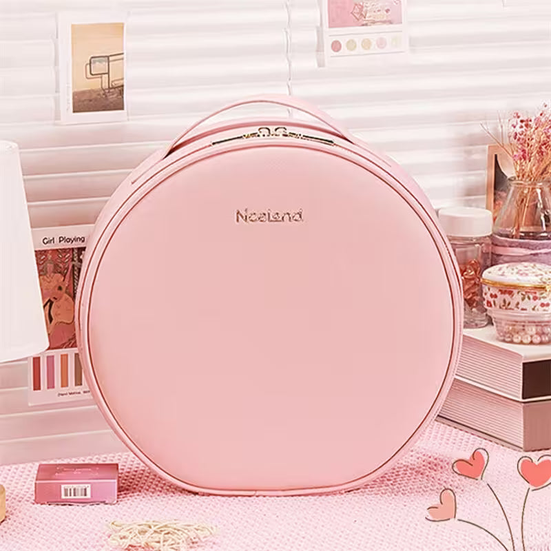Pink round bag with 'Nacenda' branding on a decorative surface.