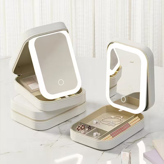 Set of cosmetic mirrors with LED lights on a white surface