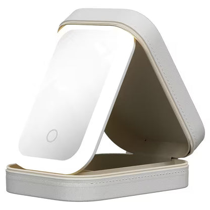 Foldable light with a white base and beige top on a white background