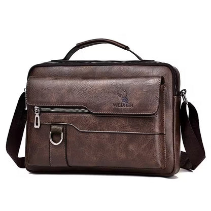 Brown leather briefcase with shoulder strap on a white background