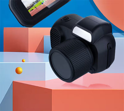 Black camera lens on a colorful geometric background