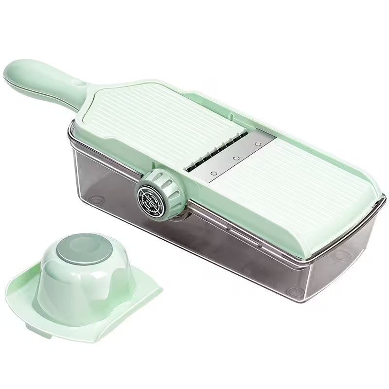 Mint green kitchen slicer with a clear container on a white background