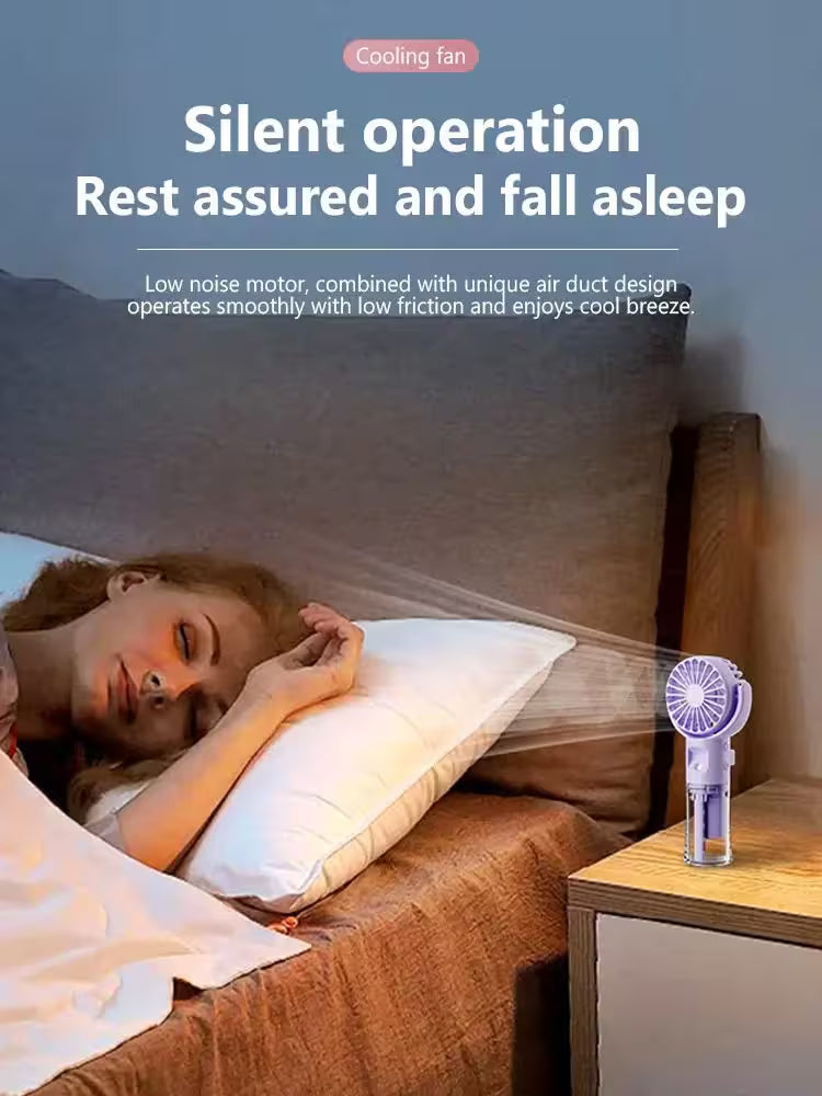 Person sleeping in bed with a cooling fan on a nightstand, emphasizing silent operation.