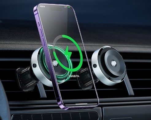 Smartphone with a protective glass screen in a car mount, showing charging icon.