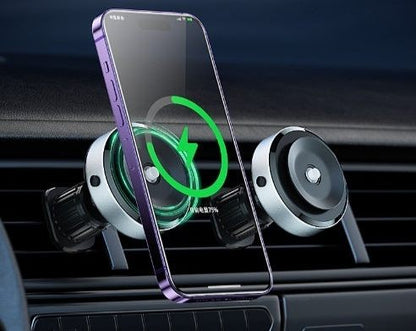 Smartphone with a protective glass screen in a car mount, showing charging icon.