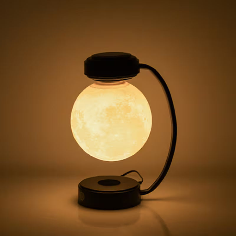 Glowing spherical lamp with a black base on a brown background