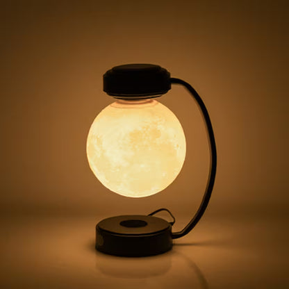 Glowing spherical lamp with a black base on a brown background