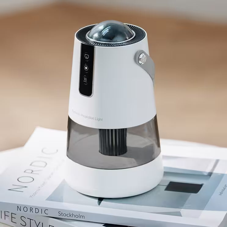 White and black portable projector on a magazine with a blurred background